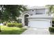 This two-story home has manicured landscaping and a welcoming front porch at 1426 Park Park, Haines City, FL 33844