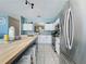 Bright kitchen with stainless steel appliances, white cabinetry, and a butcher block island at 1426 Park Park, Haines City, FL 33844