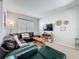 Cozy living room featuring a plush sectional sofa, large window, and decorative accents at 1426 Park Park, Haines City, FL 33844