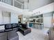 Open-concept living space connects living, dining, and kitchen areas, enhancing the home's spacious feel at 1426 Park Park, Haines City, FL 33844