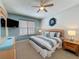 Bedroom with soft carpet, ceiling fan, and natural light from the window at 1426 Park Park, Haines City, FL 33844