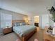 Spacious main bedroom suite with neutral colors, large bed, and ensuite bathroom at 1426 Park Park, Haines City, FL 33844