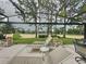 Lounge on the patio with serene views of the golf course, providing a perfect backdrop for relaxation and entertainment at 1426 Park Park, Haines City, FL 33844