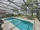 Relaxing screened-in pool and spa area with outdoor seating, ideal for entertaining at 1426 Park Park, Haines City, FL 33844