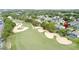 The aerial view shows the home's location near the golf course and the manicured landscaping of the community at 1428 Park Pl, Haines City, FL 33844