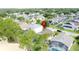 An aerial view features a neighborhood with green trees, showcasing the home's location within the community at 1428 Park Pl, Haines City, FL 33844