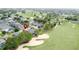 This aerial shot shows a desirable home location near a golf course and showcases the lush community surroundings at 1428 Park Pl, Haines City, FL 33844