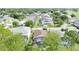 An aerial view shows a neighborhood with lush greenery, homes, and well-maintained lawns at 1428 Park Pl, Haines City, FL 33844