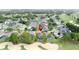 This aerial view shows home's desirable location with golf course views, trees, and easy community access at 1428 Park Pl, Haines City, FL 33844