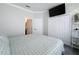Relaxing bedroom features a TV, soft lighting and a spacious closet, perfect for modern living at 1428 Park Pl, Haines City, FL 33844