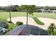 Aerial view of a golf course with a sand trap and green, with residential properties in the background at 1428 Park Pl, Haines City, FL 33844