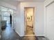 Hallway view leads to a well-lit bathroom and living spaces, highlighting the home's layout at 1428 Park Pl, Haines City, FL 33844