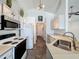 Well-lit kitchen featuring bright white cabinets, modern appliances, ample counter space, and tile flooring at 1428 Park Pl, Haines City, FL 33844