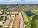 High aerial view of the neighborhood featuring multiple ponds and community amenities, showcasing its tranquil setting at 14344 Swanley St, Orlando, FL 32832