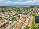 Sweeping aerial shot of neighborhood with lakes, golf course, and tennis courts providing recreational opportunities at 14344 Swanley St, Orlando, FL 32832