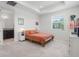 Bright bedroom with large window, side table and comfortable warm colored bedding at 14344 Swanley St, Orlando, FL 32832