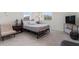 Cozy bedroom featuring carpet, large windows and comfortable furnishings at 14344 Swanley St, Orlando, FL 32832