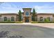 Elegant clubhouse exterior with stone accents, arched windows, and manicured landscaping at 14344 Swanley St, Orlando, FL 32832