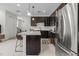 Stylish kitchen with stainless steel appliances, a granite island, and an open layout to the living area at 14344 Swanley St, Orlando, FL 32832