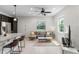 Bright living room featuring tile flooring, recessed lighting, a ceiling fan, and two large windows at 14344 Swanley St, Orlando, FL 32832
