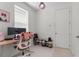 Bright office space with a modern desk setup, ample storage, and natural light from a window at 14344 Swanley St, Orlando, FL 32832