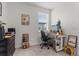 Well-lit office space with a dedicated workspace, creative decor, and comfortable carpeting at 14344 Swanley St, Orlando, FL 32832