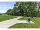A park with a bench sitting near a sidewalk at 14344 Swanley St, Orlando, FL 32832