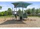Community playground with shade covering, slide, and activities on mulch flooring at 14344 Swanley St, Orlando, FL 32832