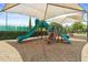 Large green slide and playground equipment with shade and mulch flooring at 14344 Swanley St, Orlando, FL 32832