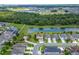 Wonderful aerial view of the community surrounding a lake with green spaces, offering a serene and nature-filled neighborhood at 14421 Ward Rd, Orlando, FL 32824