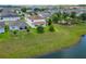 This home features a spacious backyard that adjoins to a pond, offering a private, peaceful retreat in a beautiful setting at 14421 Ward Rd, Orlando, FL 32824