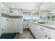 Bathroom featuring double sink vanity with large glass shower and a view at 14421 Ward Rd, Orlando, FL 32824