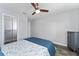 This bedroom features hardwood floors, a ceiling fan, and a closet at 14421 Ward Rd, Orlando, FL 32824