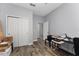 Bedroom featuring a double closet, a desk with printer and chair at 14421 Ward Rd, Orlando, FL 32824