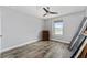 This bedroom features hardwood floors, a window, and a wooden dresser at 14421 Ward Rd, Orlando, FL 32824