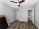 This bedroom features a closet, hardwood floors, and a ceiling fan at 14421 Ward Rd, Orlando, FL 32824
