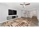 Bonus room with large screen TV, ceiling fan, modern floors at 14421 Ward Rd, Orlando, FL 32824