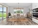 Bright dining room showcasing a table and chairs set with a sliding door to the exterior at 14421 Ward Rd, Orlando, FL 32824