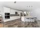 Bright kitchen with a center island, pendant lights, and stainless steel appliances for modern living at 14421 Ward Rd, Orlando, FL 32824