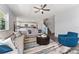 Bright living room adjacent to the kitchen features a ceiling fan, wood floors, and comfortable seating at 14421 Ward Rd, Orlando, FL 32824