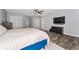 Main bedroom featuring a large bed, closet, TV at 14421 Ward Rd, Orlando, FL 32824