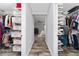 Walk-in closet with custom shelving and ample storage at 14421 Ward Rd, Orlando, FL 32824