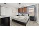A chic bedroom features a minimalist design, complemented by modern lighting and a stylish headboard at 1456 Belle Terre Rd, Davenport, FL 33896