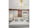 A bedroom featuring a king-sized bed, modern decor, and an overhead light fixture at 1456 Belle Terre Rd, Davenport, FL 33896