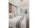 A bedroom featuring a king-sized bed, modern decor, and an overhead light fixture at 1456 Belle Terre Rd, Davenport, FL 33896