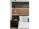 Modern bedroom showcasing stylish wood accent wall and elegant bedside lighting at 1456 Belle Terre Rd, Davenport, FL 33896
