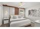 A bedroom featuring a king-sized bed, modern decor, and an overhead light fixture at 1456 Belle Terre Rd, Davenport, FL 33896