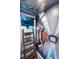 Futuristic bedroom featuring unique space-themed bunk beds and ladder at 1456 Belle Terre Rd, Davenport, FL 33896