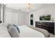 The bedroom features TV, closet, and provides a serene retreat with simple decor and a calming color palette at 1456 Belle Terre Rd, Davenport, FL 33896