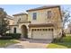 Charming two-story home with a tiled roof and inviting curb appeal at 1456 Belle Terre Rd, Davenport, FL 33896